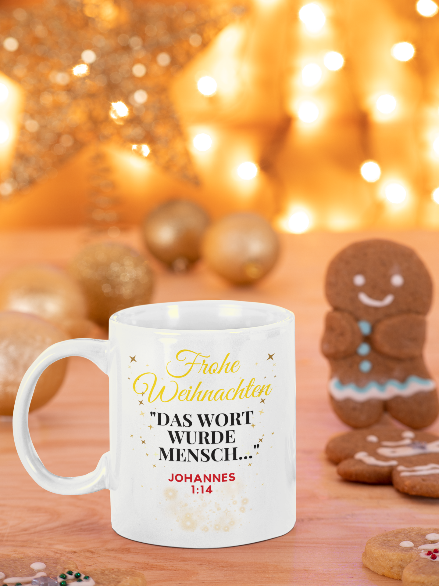 White mug with Christmas text on a wooden table with gingerbread cookies and lights in the background