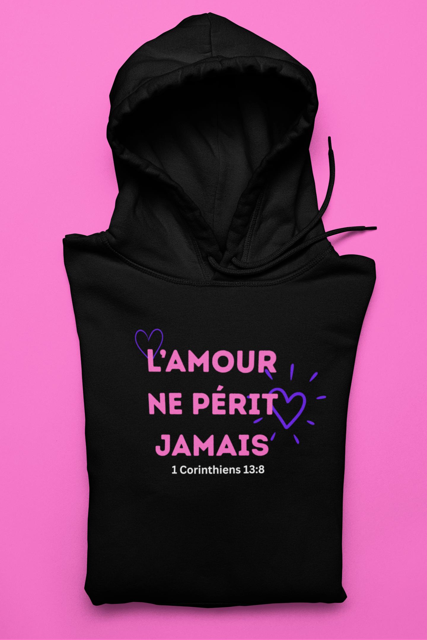 Black hoodie with pink and purple text on a pink background