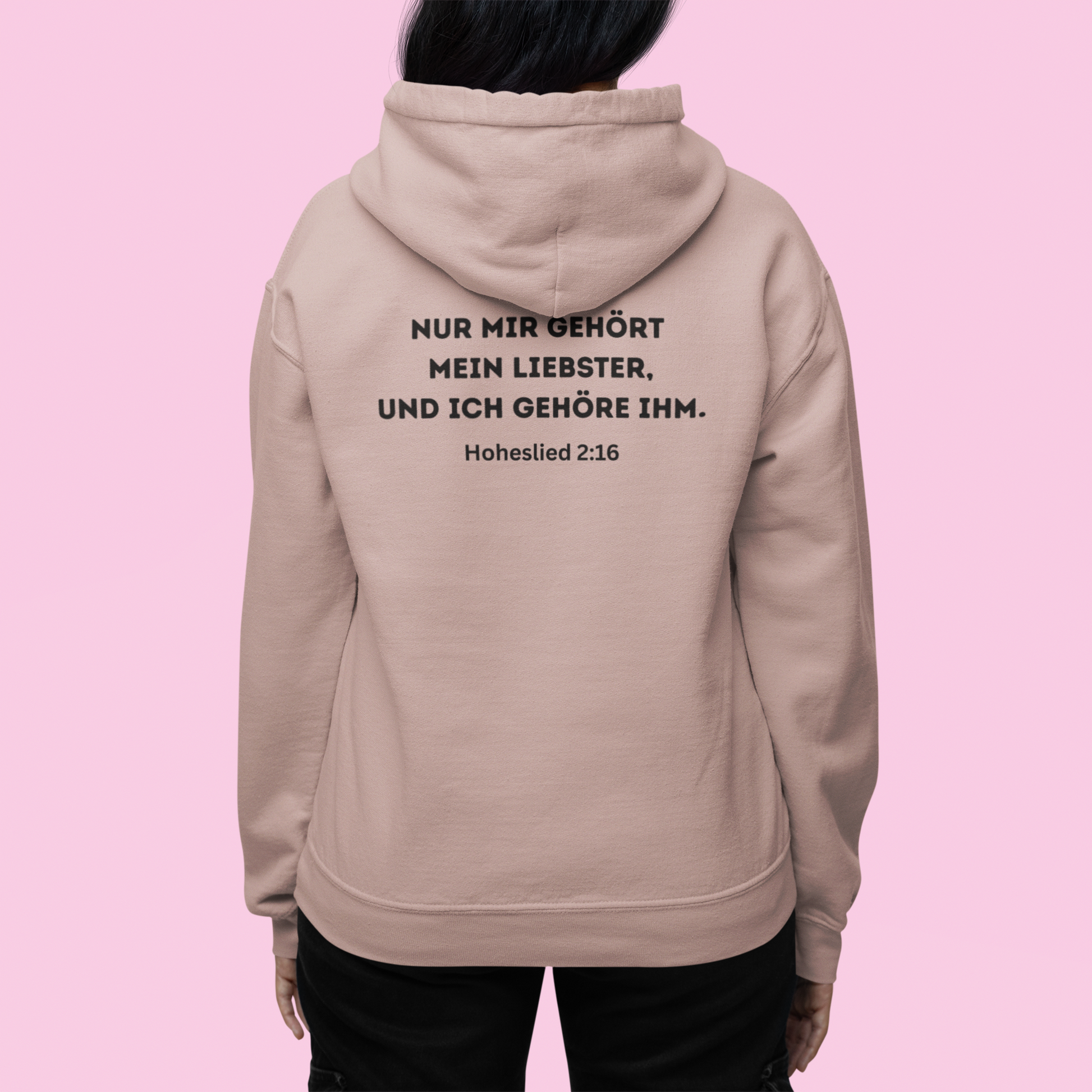 Beige hoodie with text on the back against a pink background