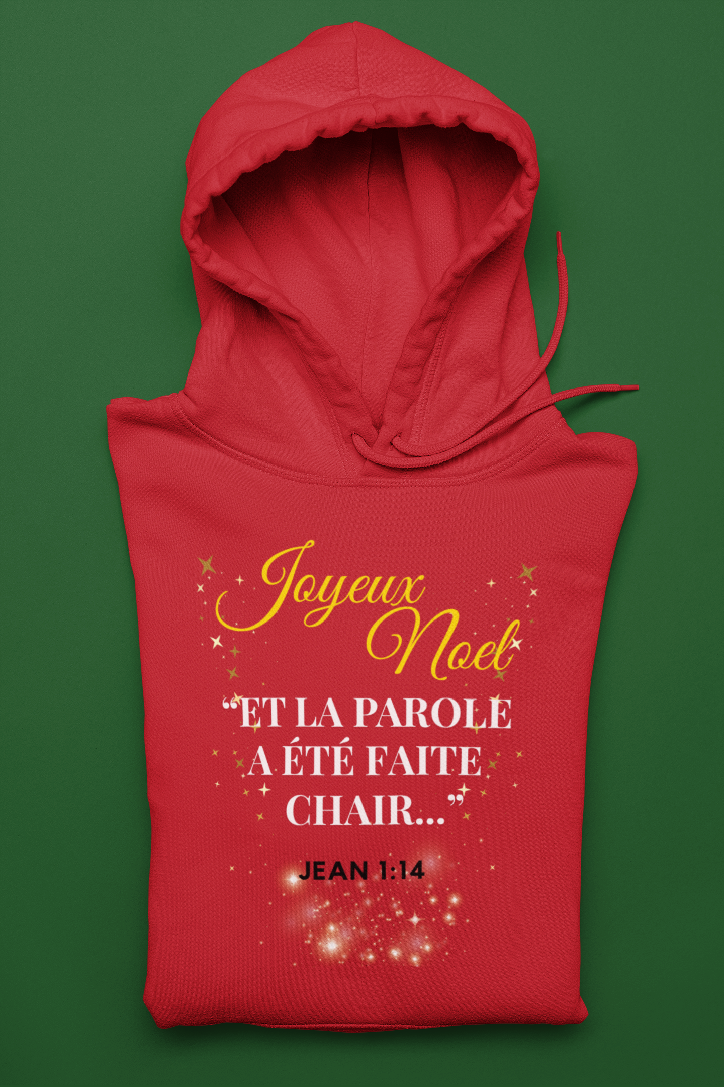 Red hoodie with Christmas text design on a green background