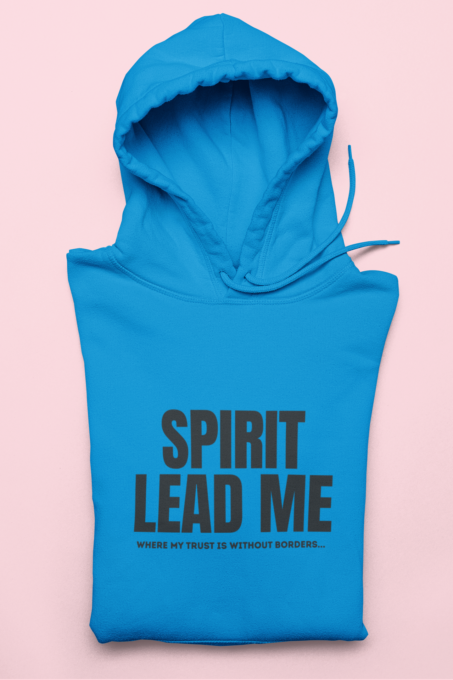 Blue hoodie with 'Spirit Lead Me' text on a pink background