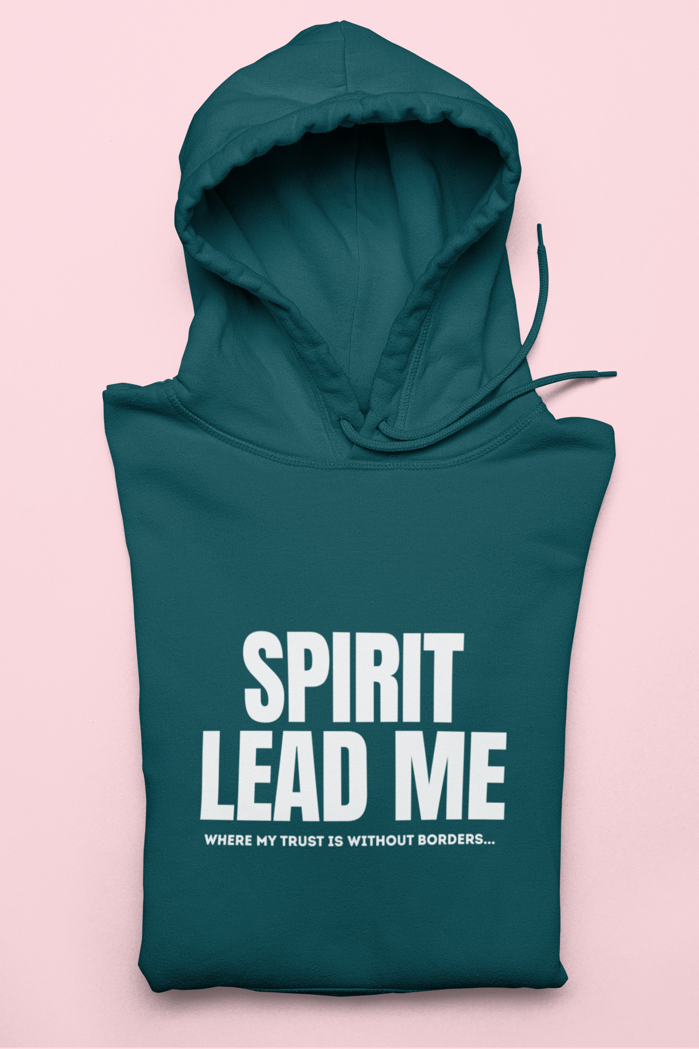 Teal hoodie with 'Spirit Lead Me' text on a pink background