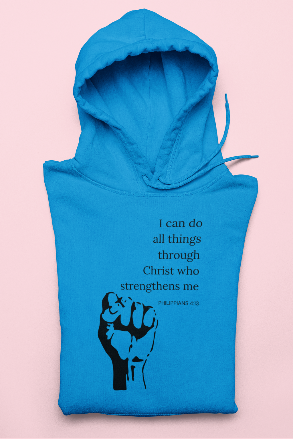 Blue hoodie with a black fist graphic and inspirational quote on a pink background