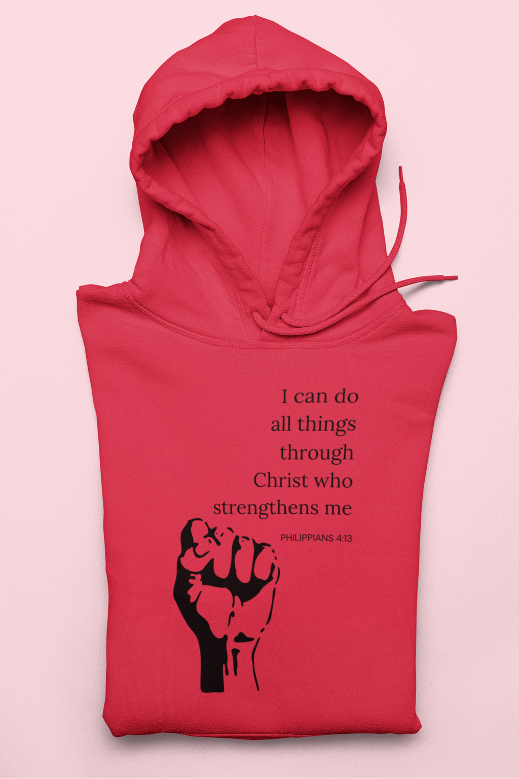 Red hoodie with black fist graphic and text on a pink background