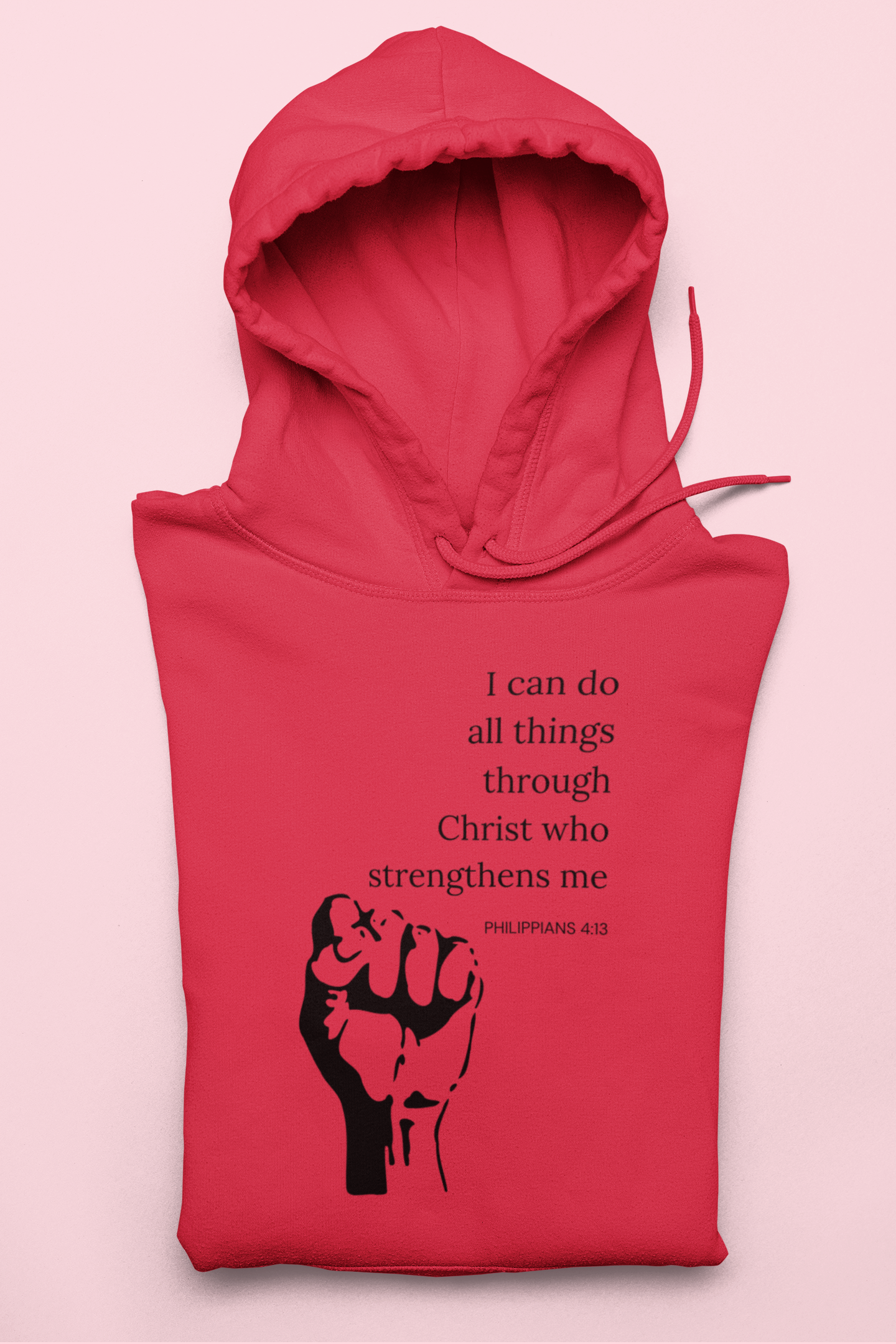 Red hoodie with black fist graphic and text on a pink background