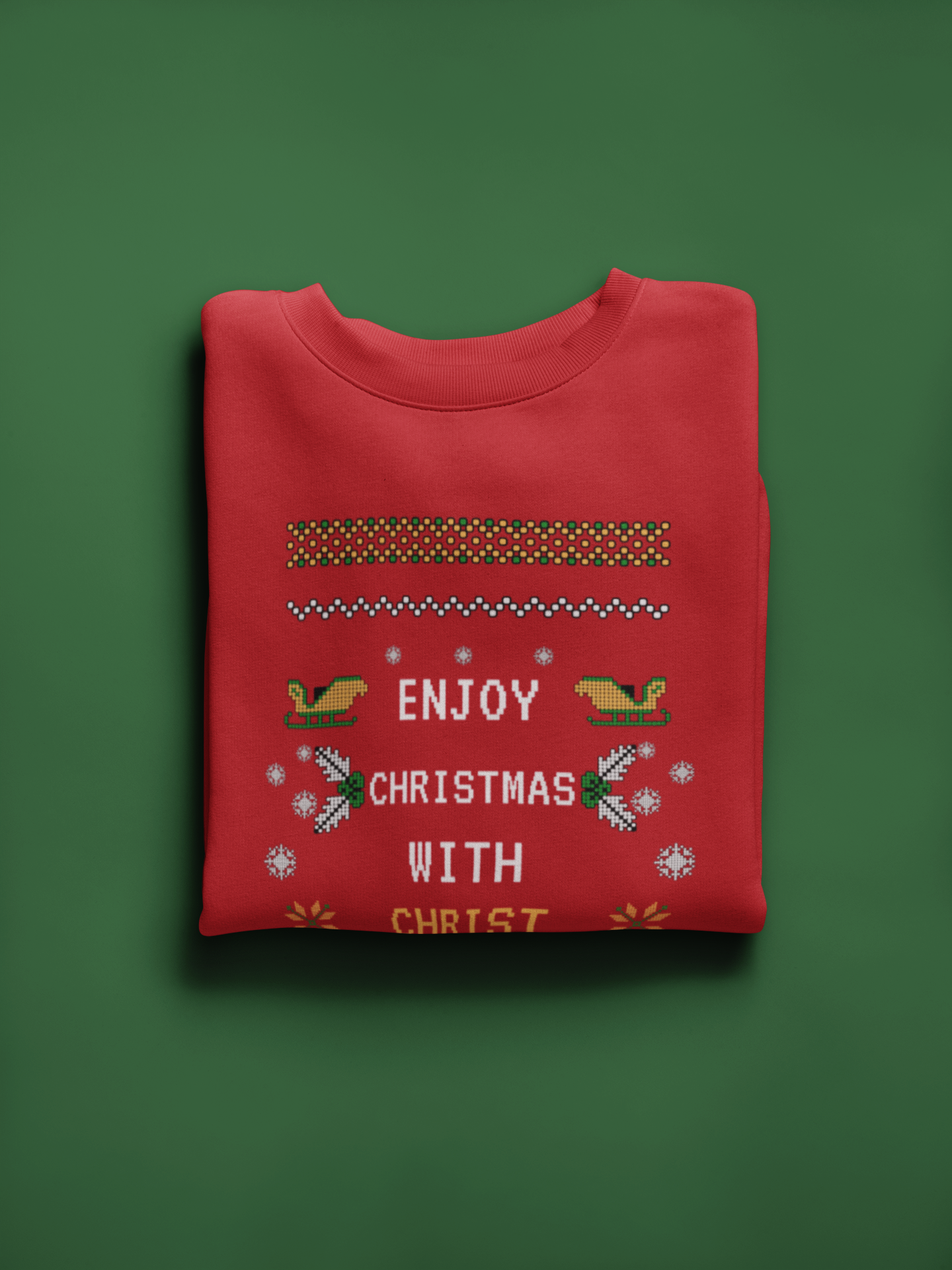 Red Christmas-themed sweatshirt with text and patterns on a green background