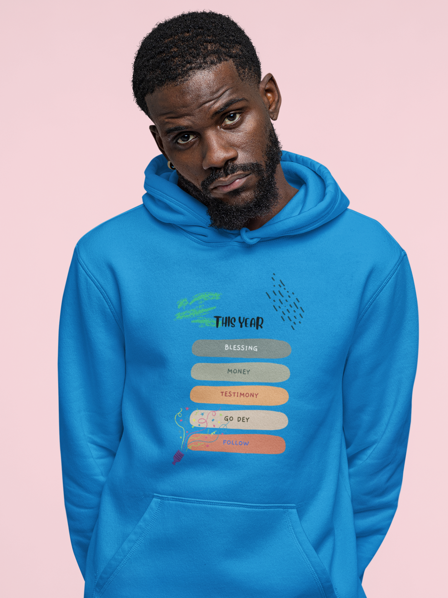 Man wearing a blue hoodie with text design on a pink background