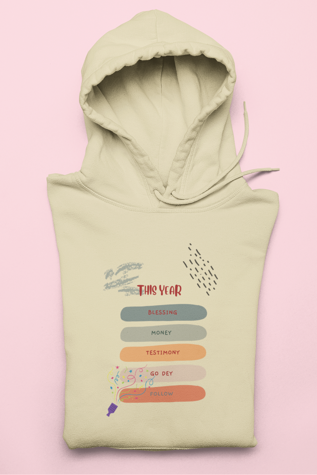 Light green hoodie with text and graphics on a pink background