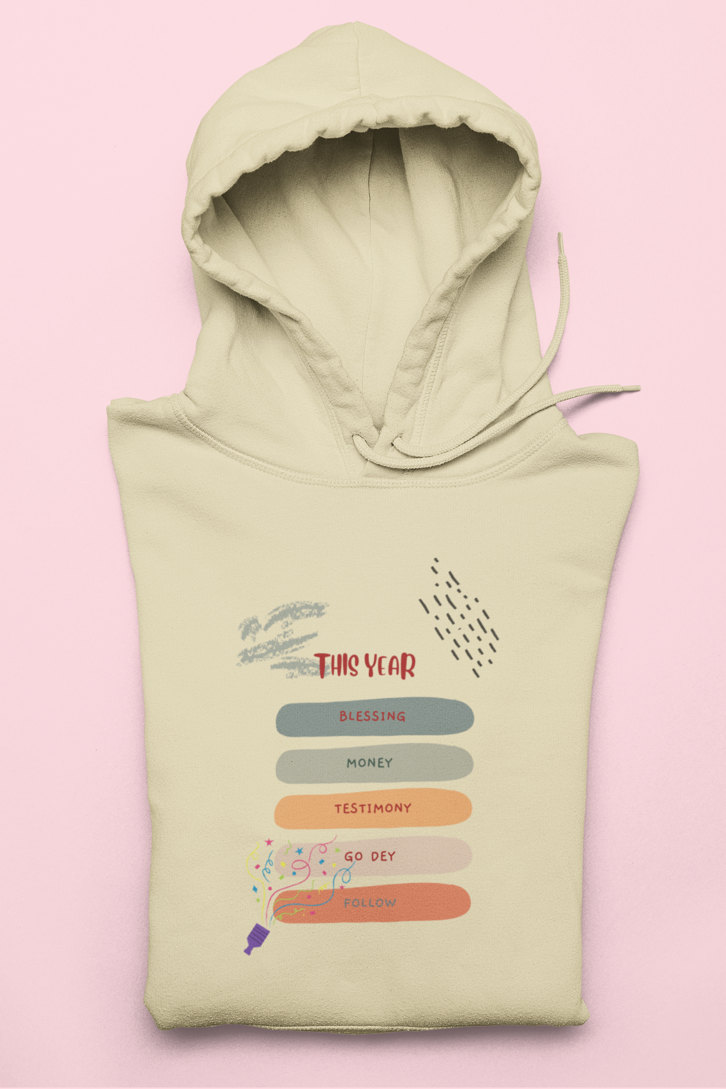 Light green hoodie with text and graphics on a pink background