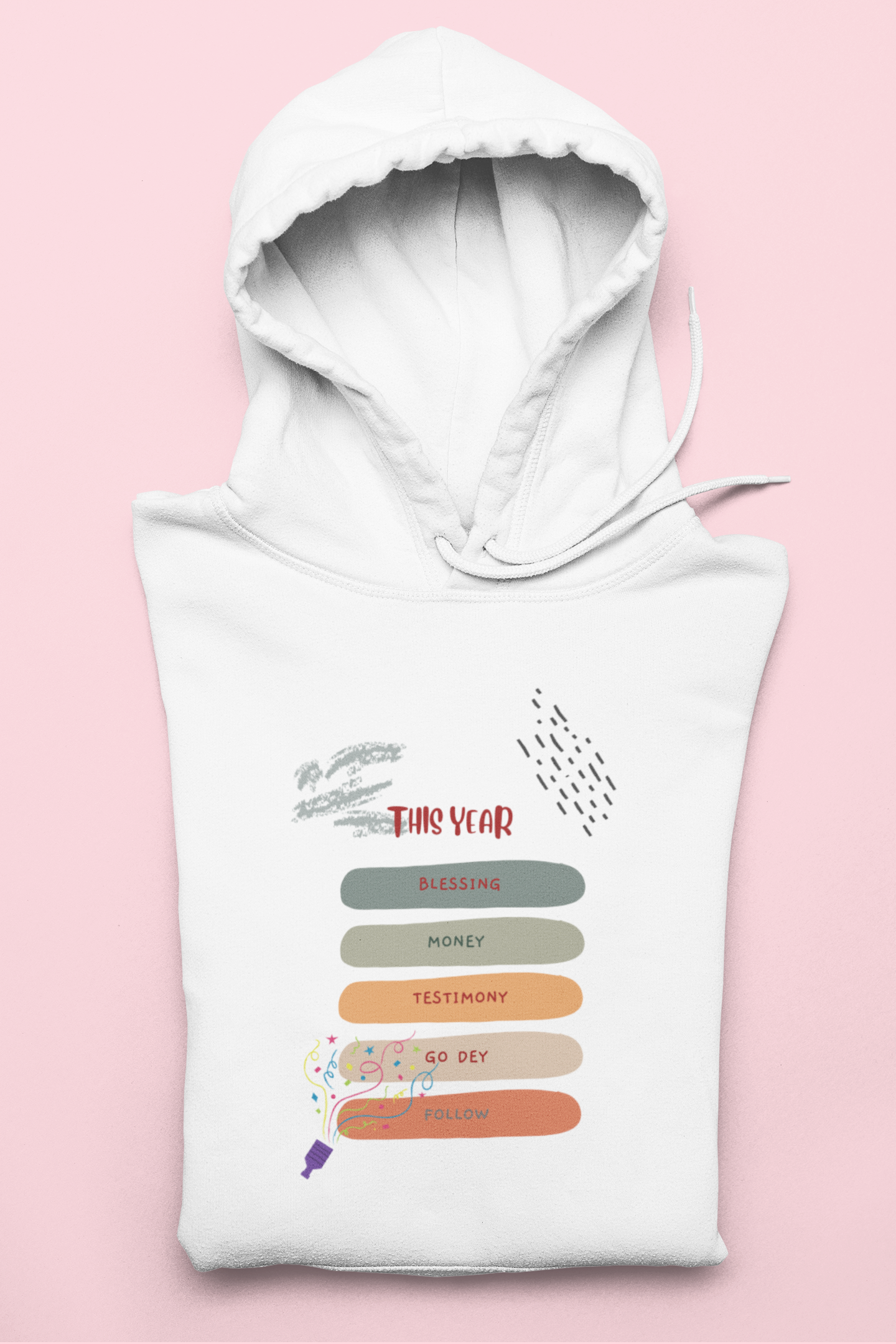 White hoodie with colorful text and graphics on a pink background