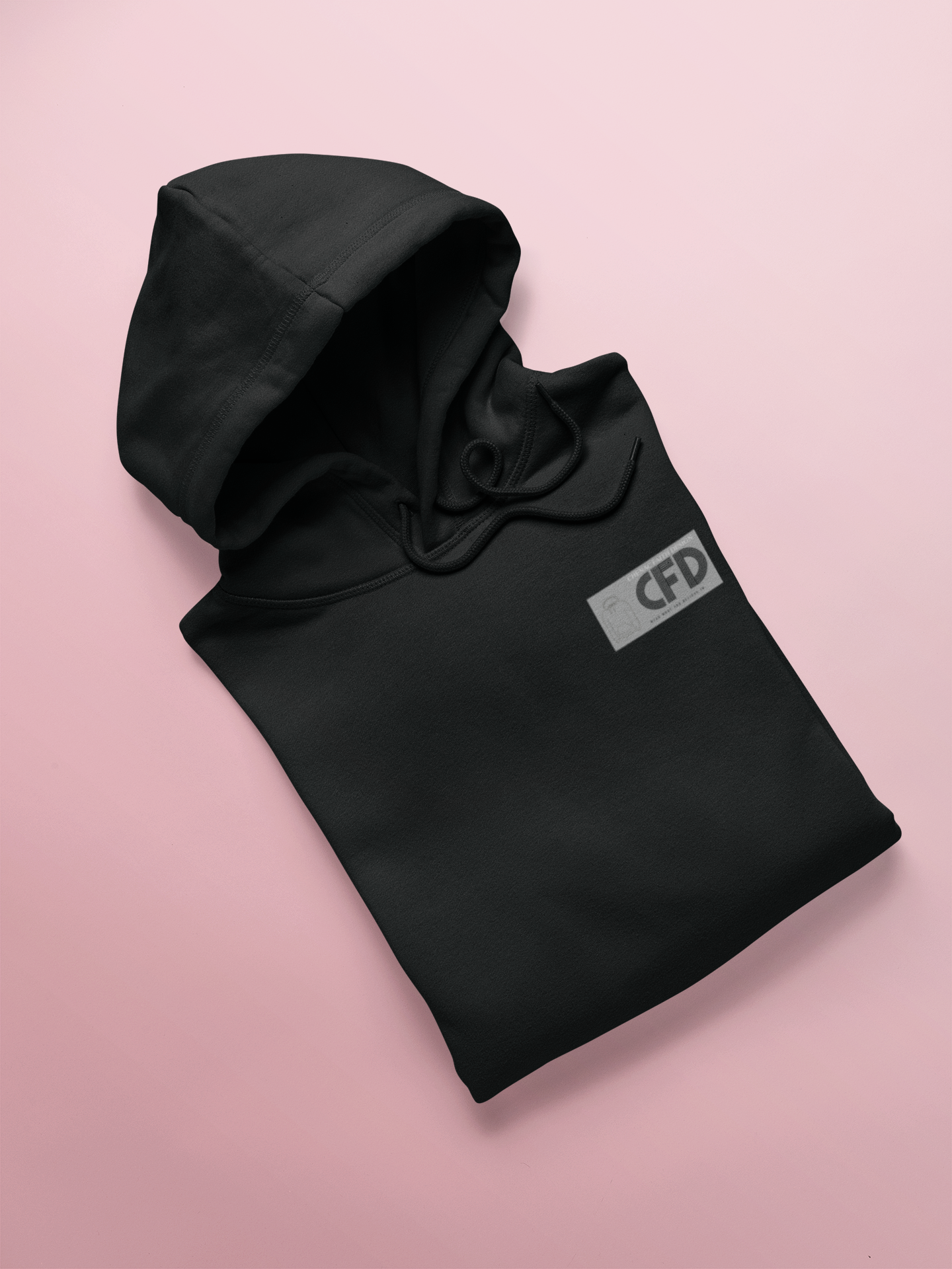 Black hoodie with 'CFD' logo on a pink background