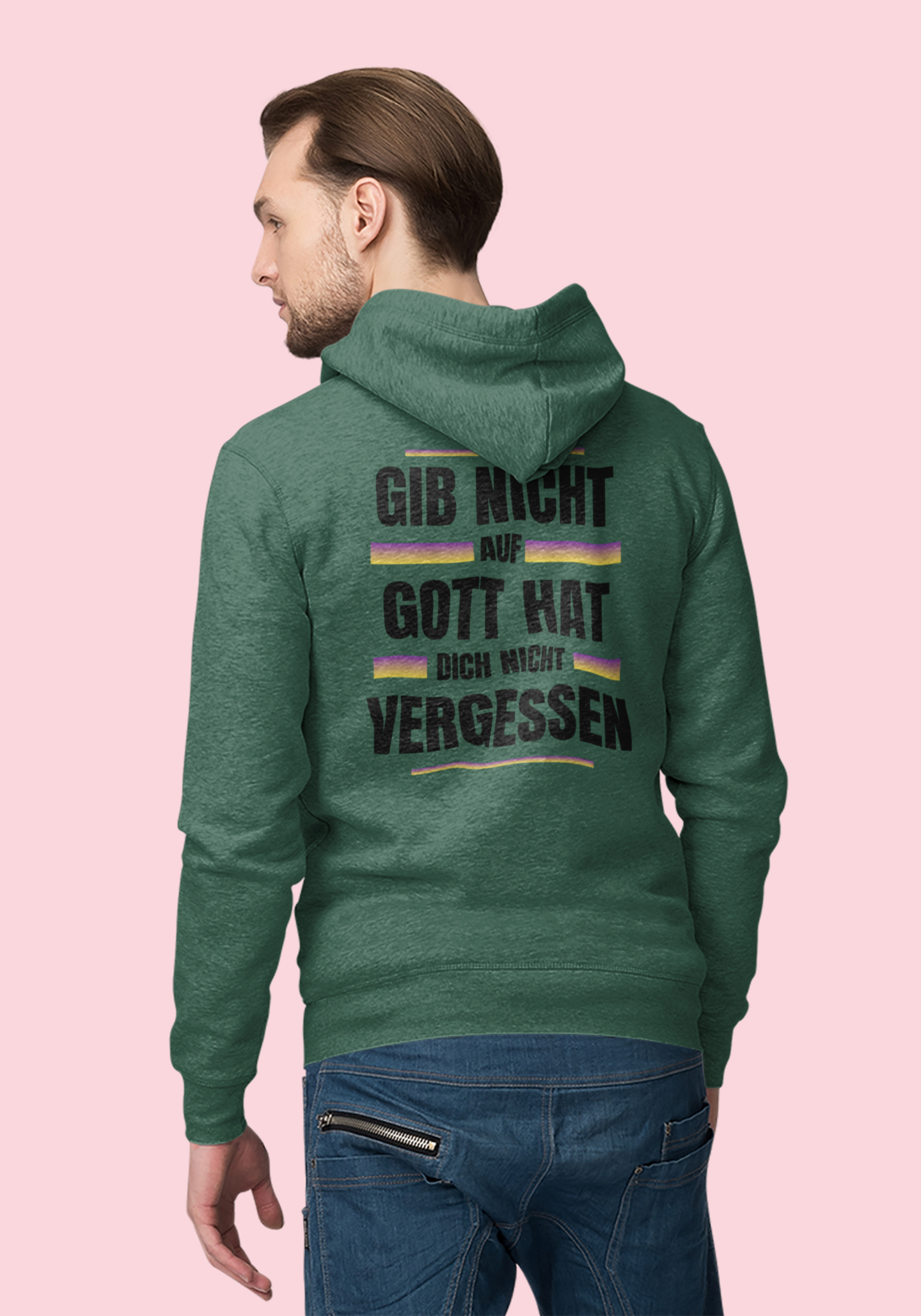 Man wearing a green hoodie with text on the back against a pink background