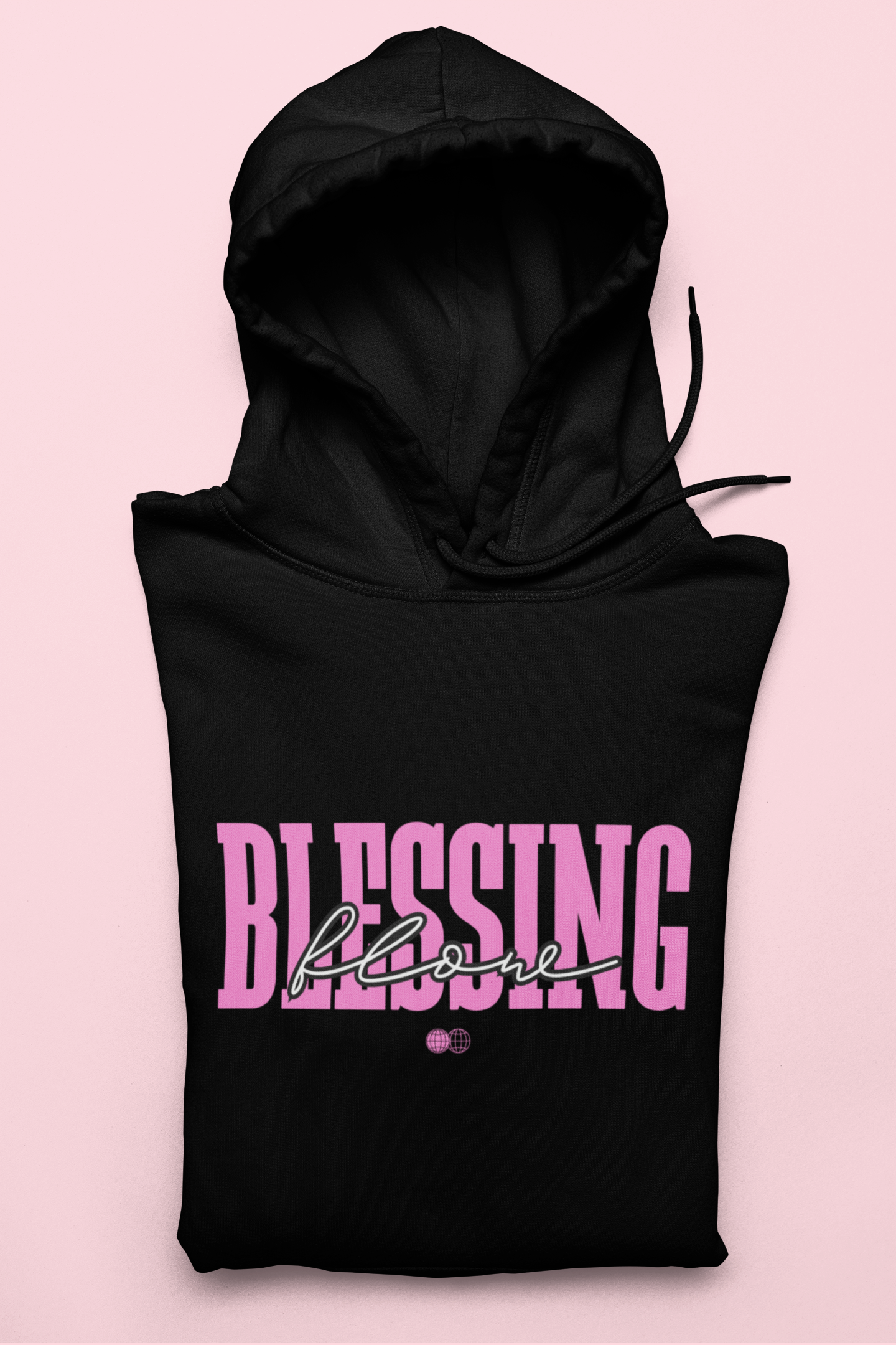 Black hoodie with pink text 'BLESSING' on a pink background