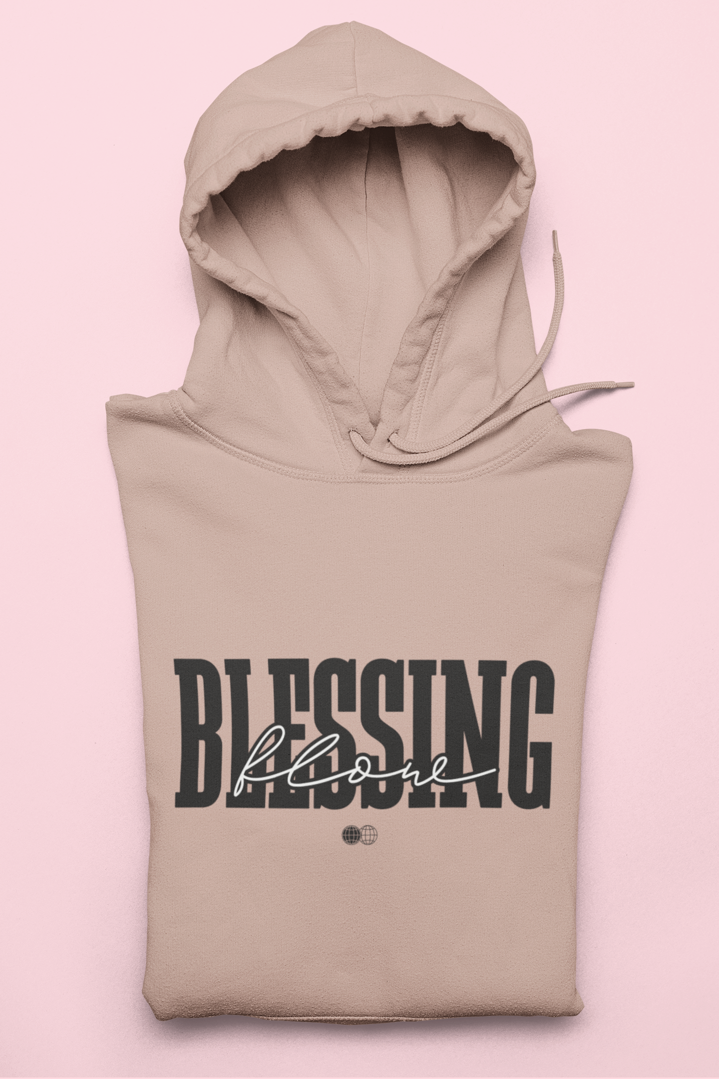 Beige hoodie with 'Blessing' text on a pink background