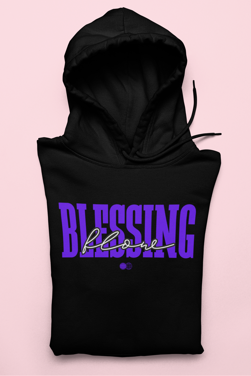 Black hoodie with 'BLESSING below' text on a pink background