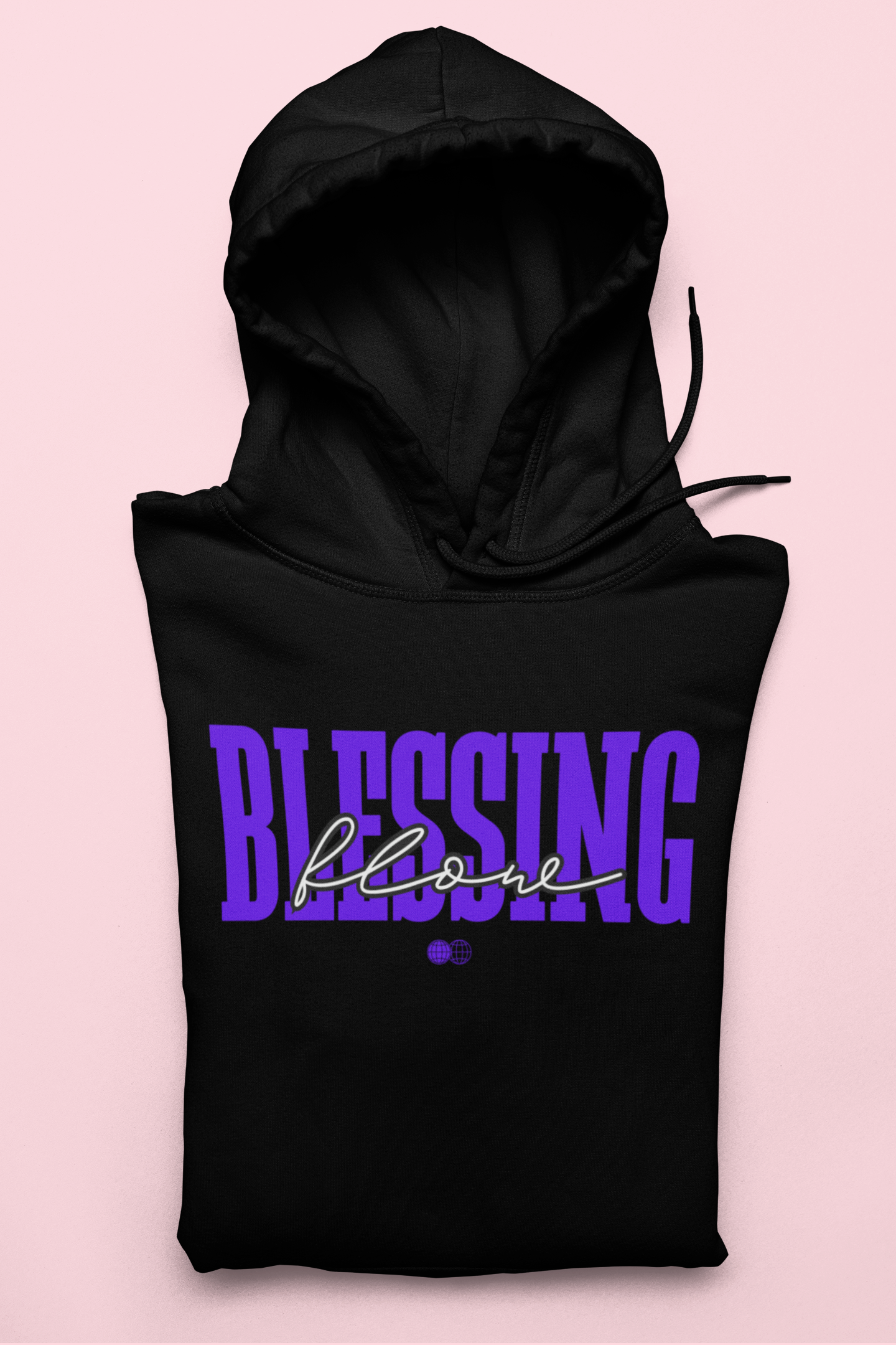 Black hoodie with 'BLESSING below' text on a pink background