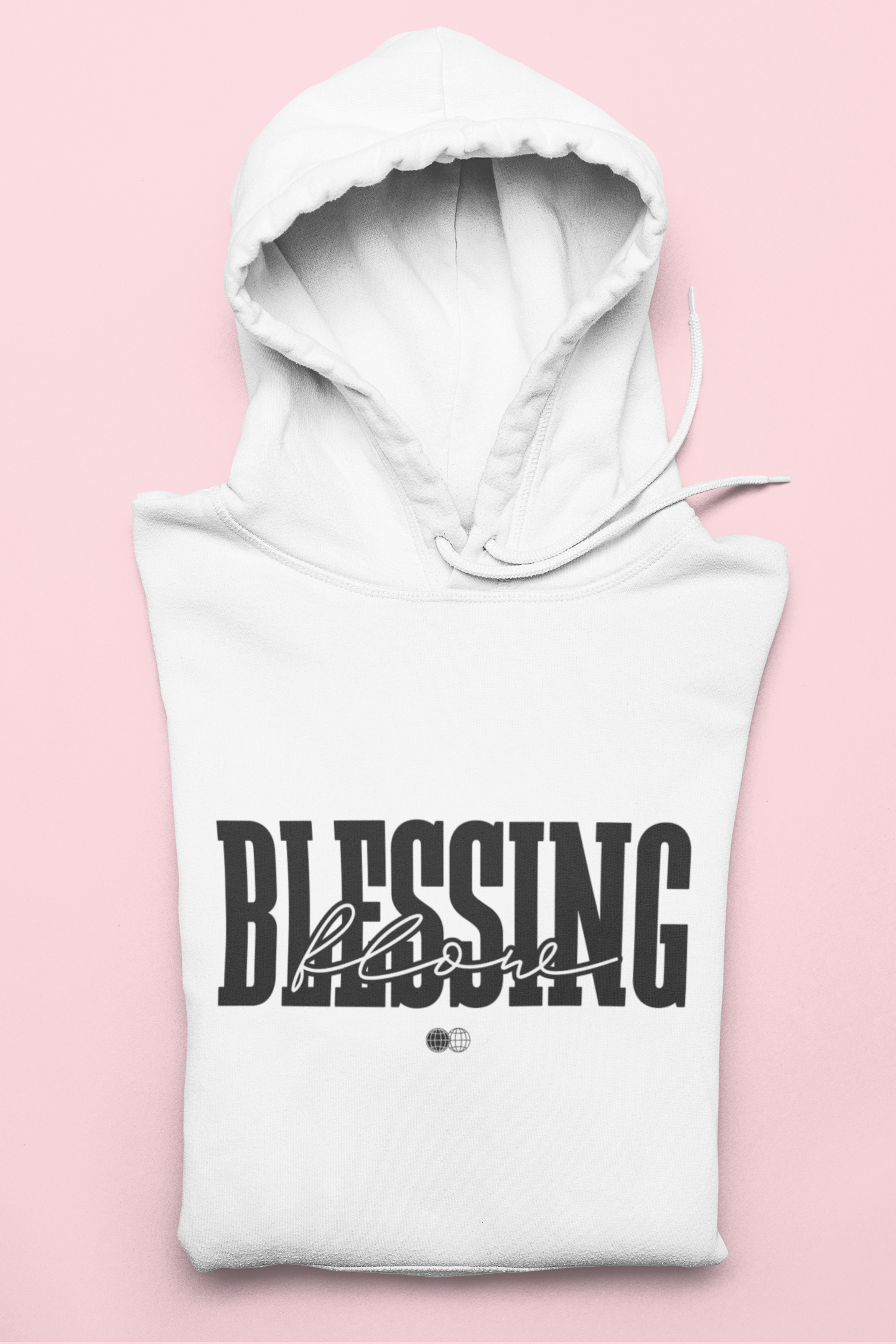 White hoodie with 'Blessing' text on a pink background