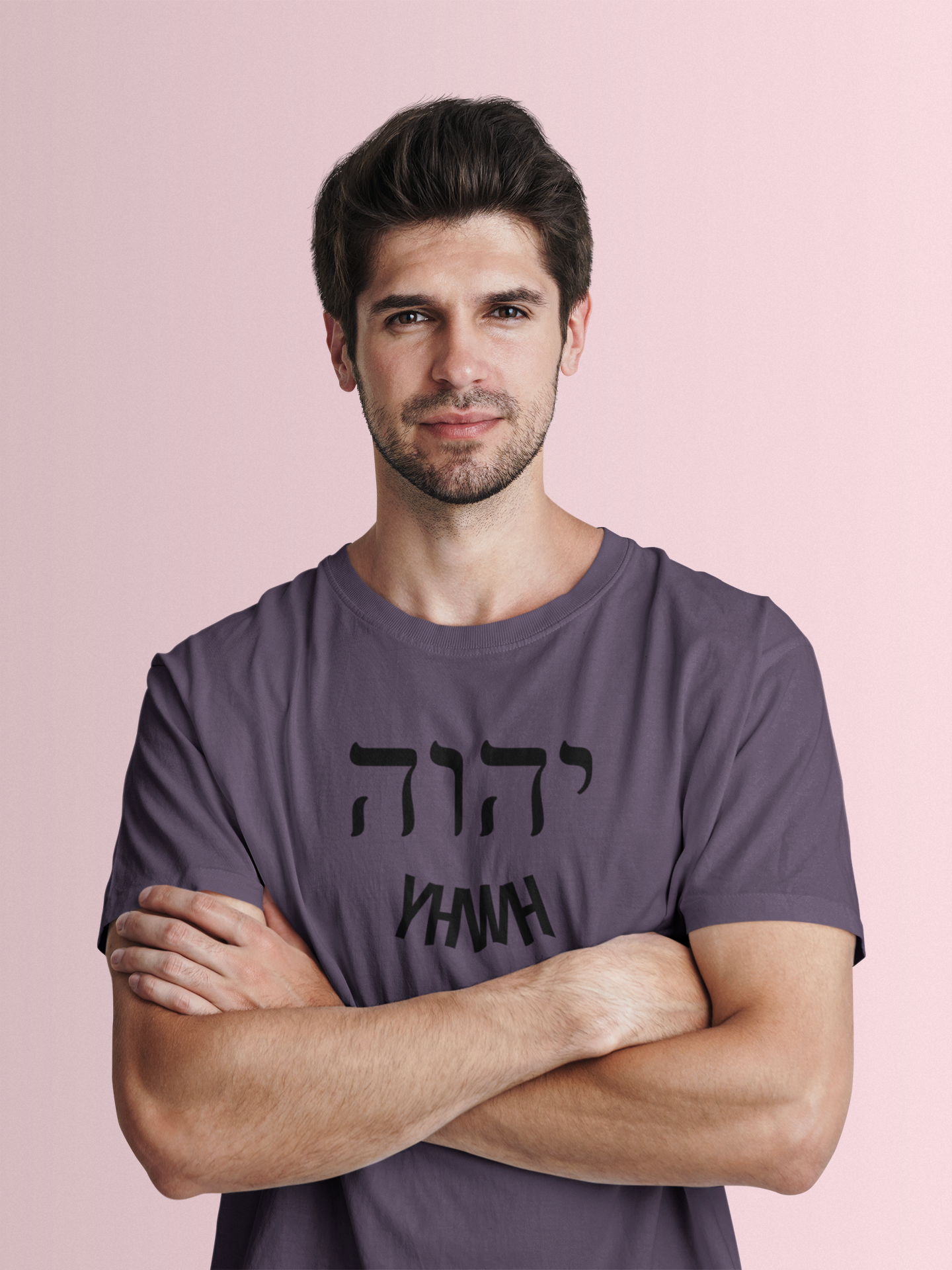 Man wearing a purple t-shirt with black text on a pink background